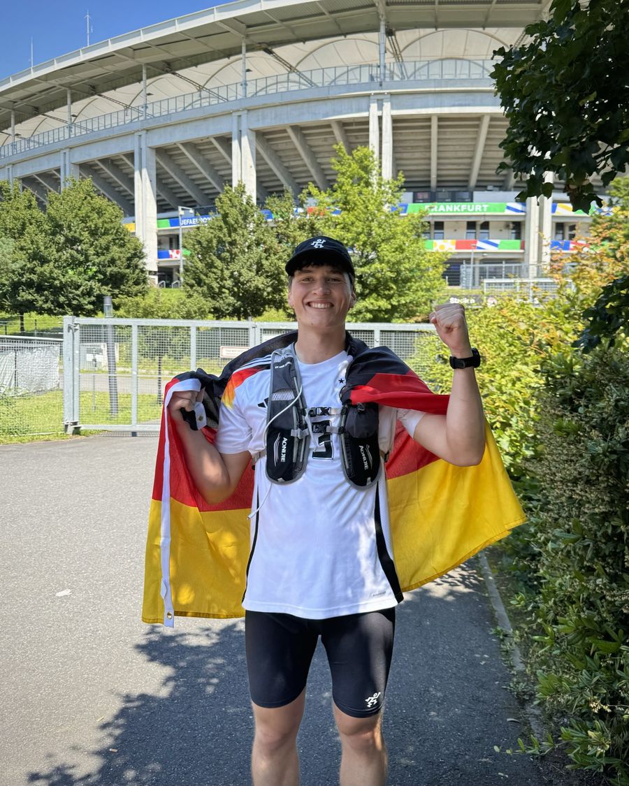 Kim with a German flag in front of a EURO 2024 stadium