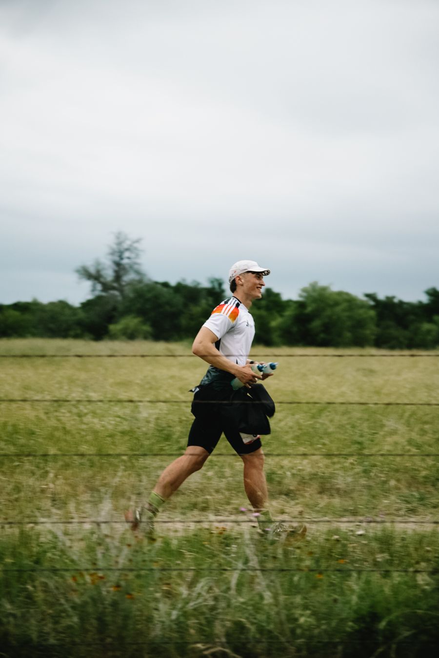 Kim running across a field at the Go One More Ultra 2025